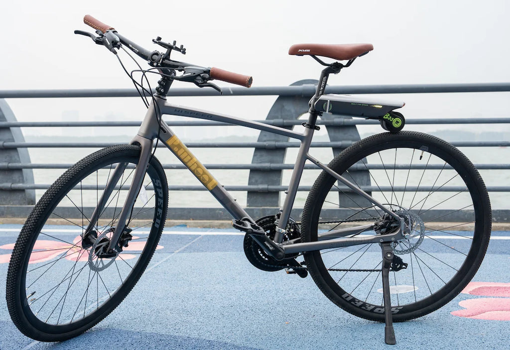 Full view of a road bicycle equipped with P.wheel smart electric bicycle booster