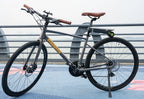 Full view of a road bicycle equipped with P.wheel smart electric bicycle booster